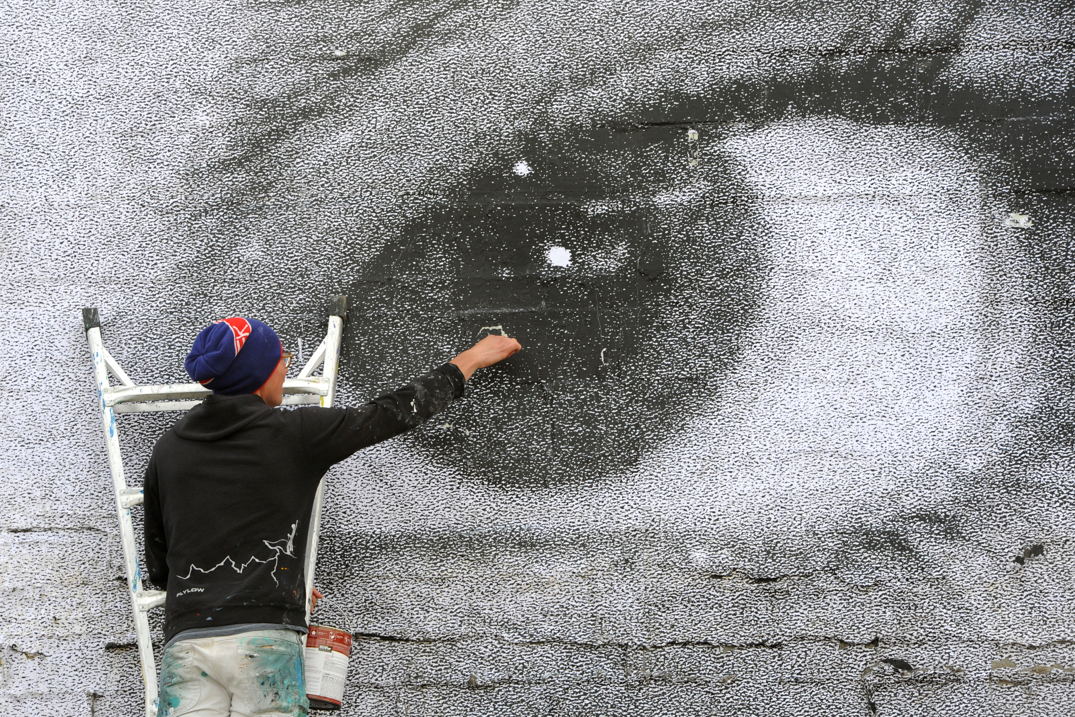 A giant new Spenard mural gazes over a storied, troubled corner